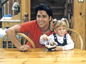 UNITED STATES - NOVEMBER 05: FULL HOUSE - "Gotta Dance" - Season Five - 11/5/91, Jesse (John Stamos) bribed Michelle (Mary Kate/Ashley Olsen) with ice cream to reveal Rebecca's plans., (Photo by ABC Photo Archives/ABC via Getty Images)